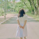 일상 속에서 지키는 정신건강, 작은 실천이 만드는 큰 변화 woman in white dress walking on road during daytime