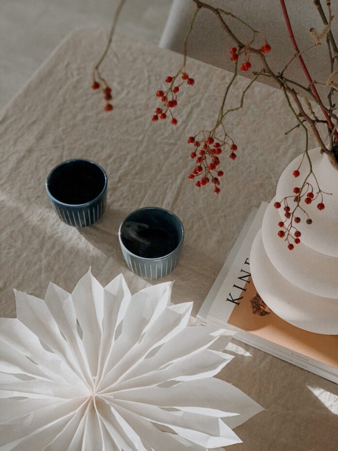 Photo by Veronika Jorjobert white ceramic bowl on white paper