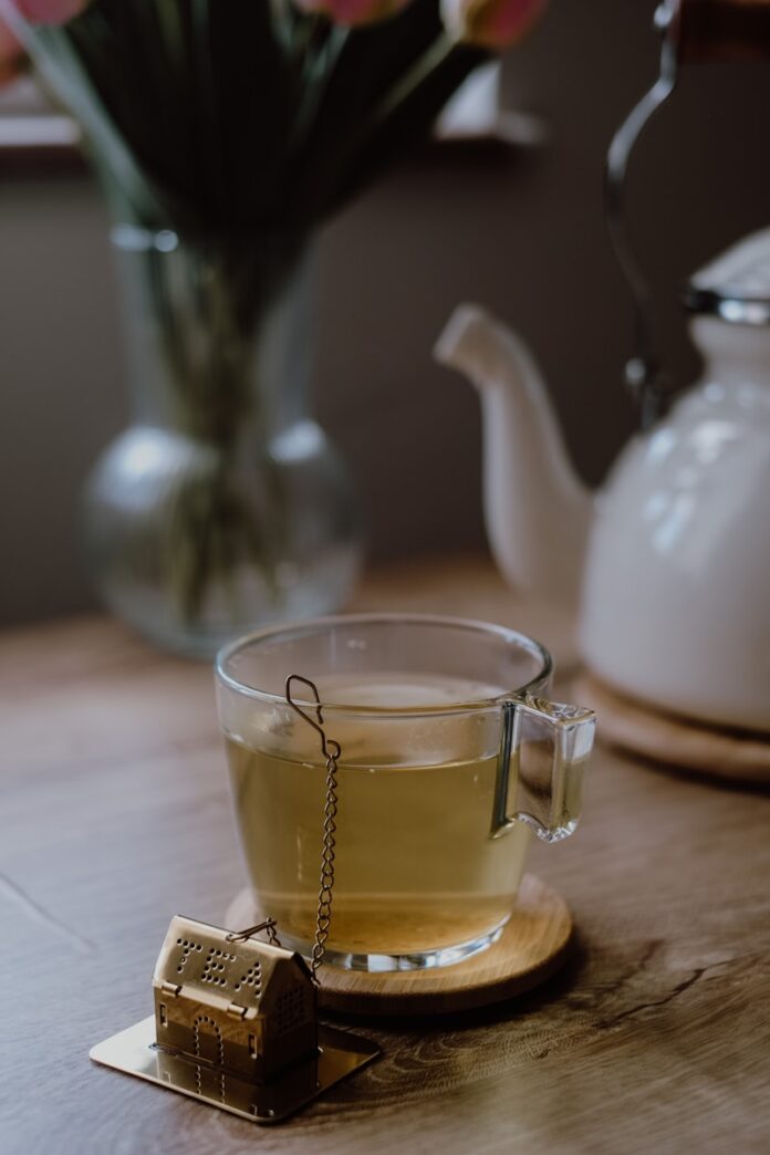 Photo by Büşra İnce a cup of tea on a wooden table